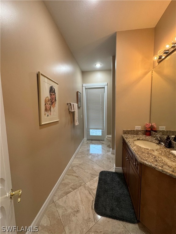 2408 River Way LaBelle, FL 33935 - Photo 8 of 21 a bathroom with a sink and a mirror
