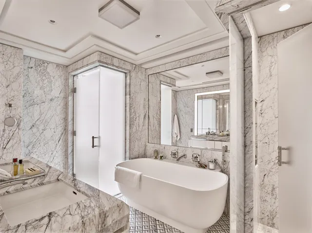 a bathroom with a sink a bathtub and a shower