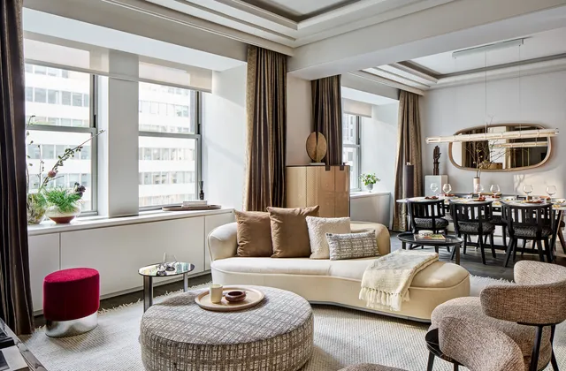 a living room with furniture and a window