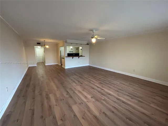 a view of a livingroom with wooden floor