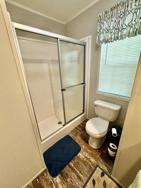 14365 Northeast 252nd Ct Road, Unit 123 Salt Springs, FL 32134 - Photo 12 of 44 a bathroom with a toilet a sink and a shower