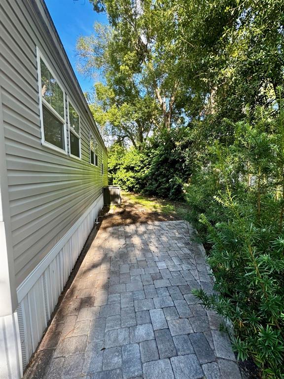 14365 Northeast 252nd Ct Road, Unit 123 Salt Springs, FL 32134 - Photo 21 of 44 a view of a backyard with pathway