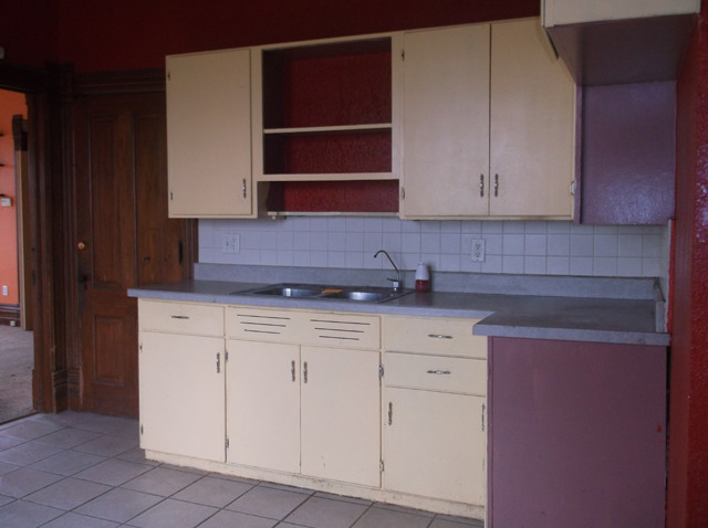 413 North 1851st Road Tonica, IL 61370 - Photo 3 of 12 a kitchen with white cabinets and a sink