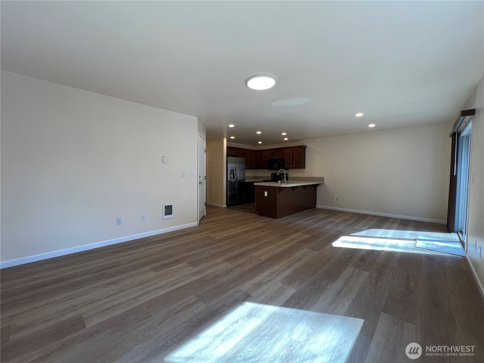 5447 57th Loop Southeast Lacey, WA 98503 - Photo 16 of 31 a view of kitchen with sink and wooden floor