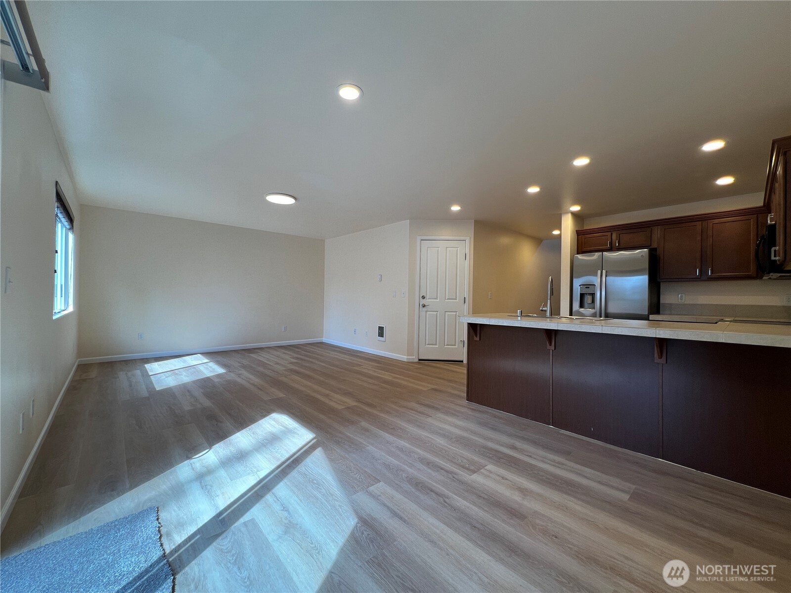 5447 57th Loop Southeast Lacey, WA 98503 - Photo 17 of 31 a view of kitchen with refrigerator and window
