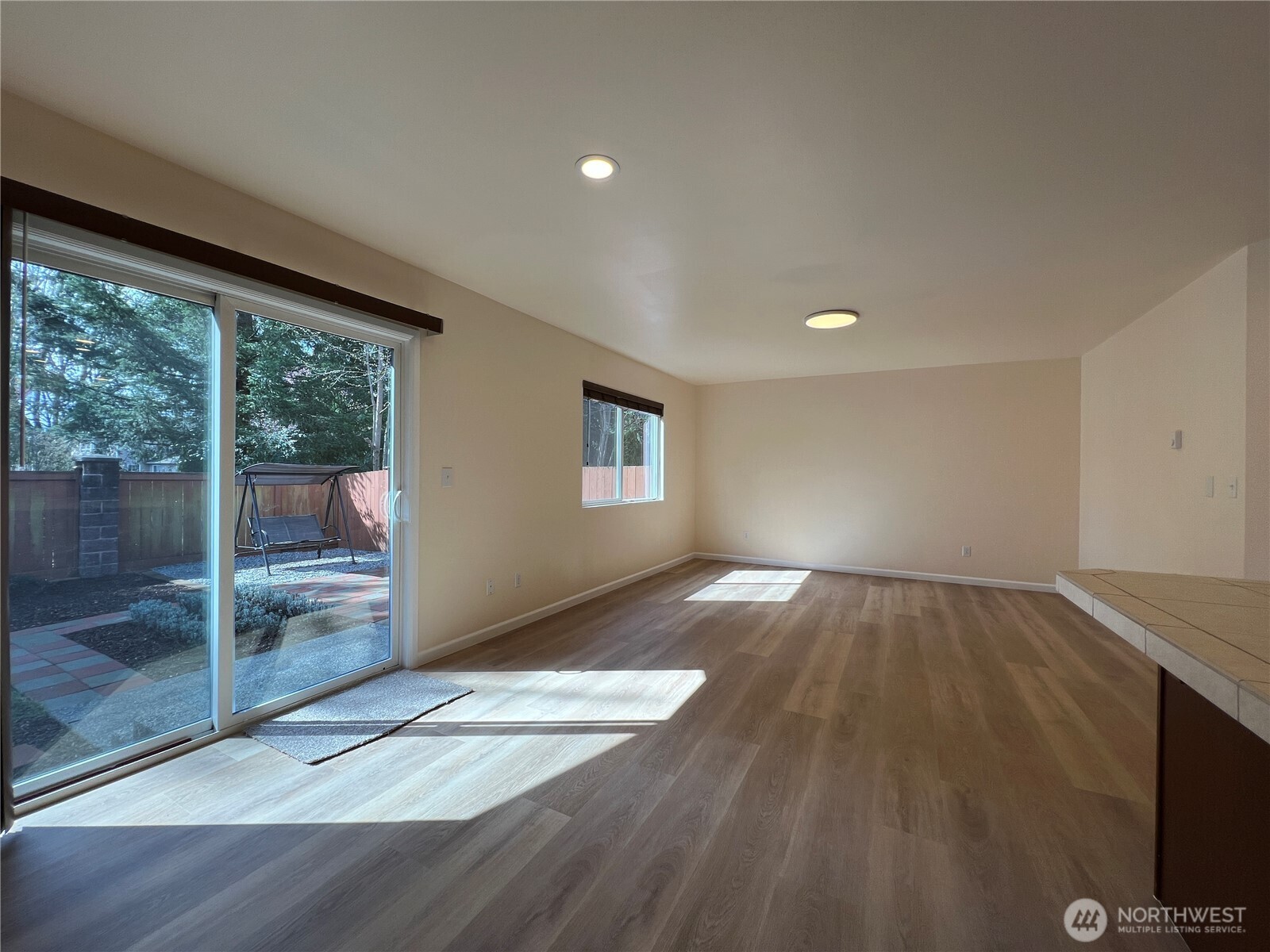 5447 57th Loop Southeast Lacey, WA 98503 - Photo 18 of 31 a view of empty room with wooden floor and fan