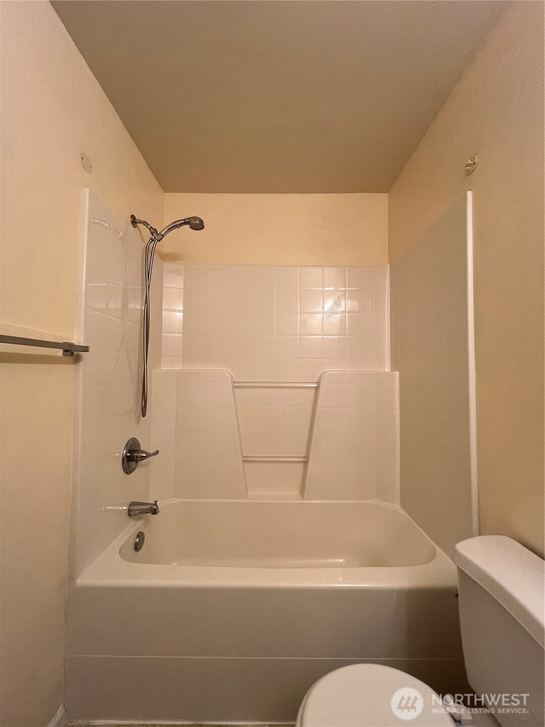5447 57th Loop Southeast Lacey, WA 98503 - Photo 29 of 31 a bathroom with a bathtub and toilet
