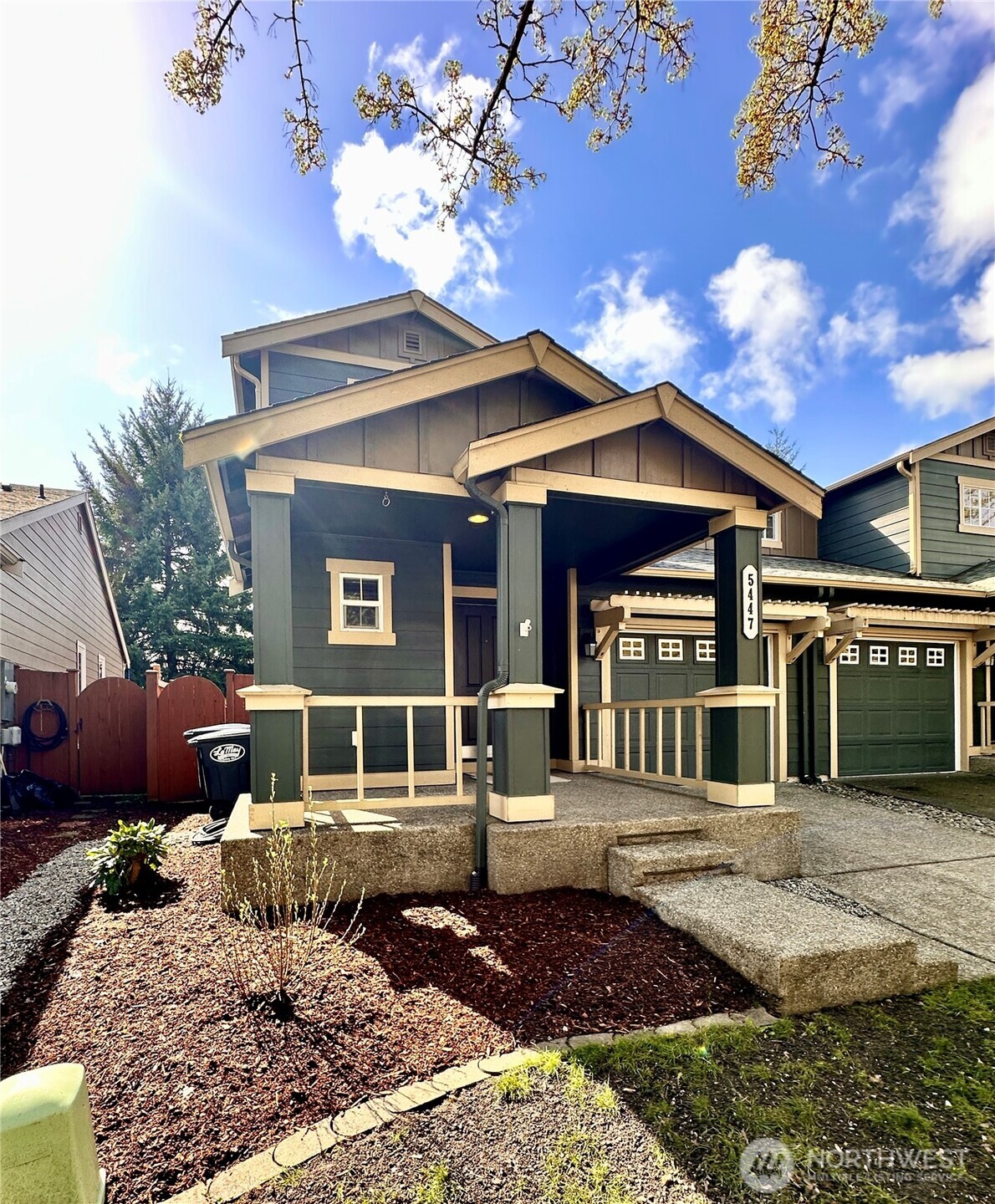 5447 57th Loop Southeast Lacey, WA 98503 - Photo 3 of 31 a front view of a house with garden