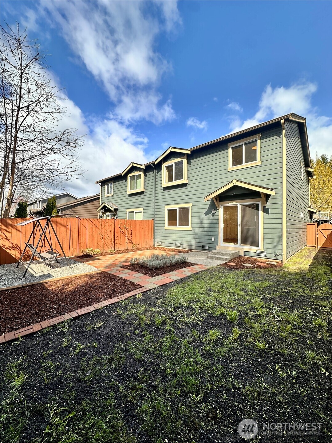 5447 57th Loop Southeast Lacey, WA 98503 - Photo 9 of 31 a front view of a house with a yard