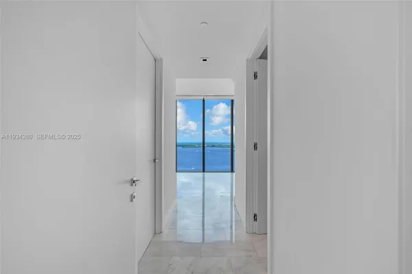 a view of an empty room with a large window