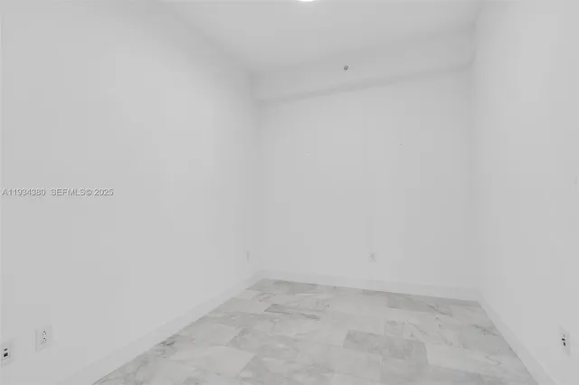 a bathroom with a bathtub shower sink vanity mirror and toilet