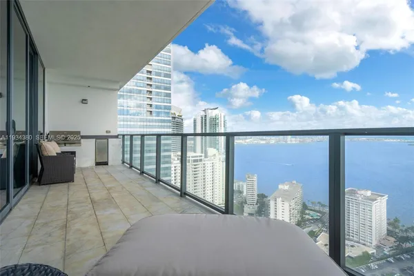 a view of balcony with furniture