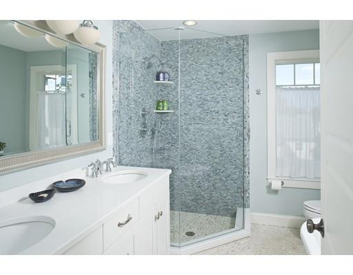 20 Brewer Beach Road Hingham, MA 02043 - Photo 13 of 38 a bathroom with a sink a mirror and a shower