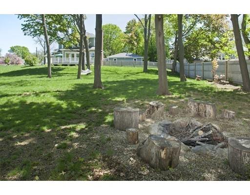 20 Brewer Beach Road Hingham, MA 02043 - Photo 27 of 38 a backyard of a house with lots of green space