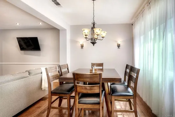 a dining room with furniture and window