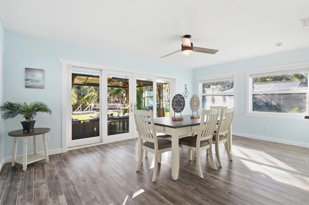 3619 North Suwanee Point Crystal River, FL 34428 - Photo 17 of 54 a view of a dining room with furniture window and wooden floor