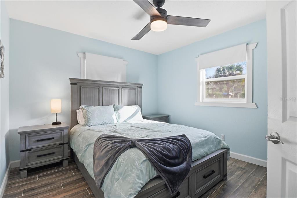 3619 North Suwanee Point Crystal River, FL 34428 - Photo 21 of 54 a bedroom with a bed and a chandelier