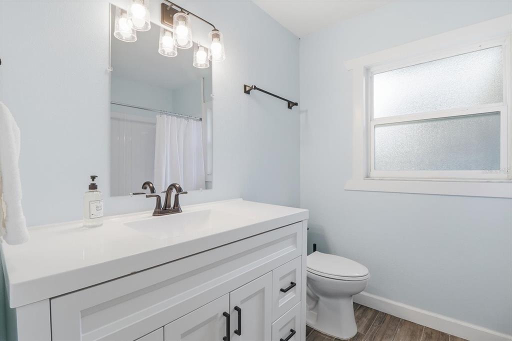 3619 North Suwanee Point Crystal River, FL 34428 - Photo 23 of 54 a bathroom with a sink a toilet and mirror