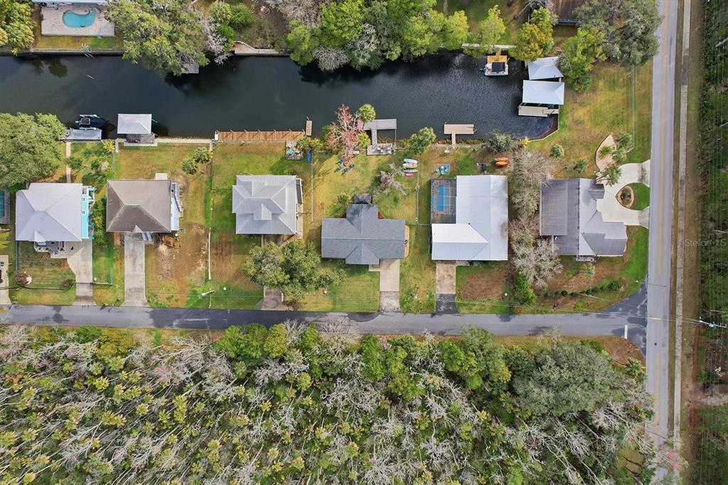 3619 North Suwanee Point Crystal River, FL 34428 - Photo 43 of 54 an aerial view of a house with a yard and a garden