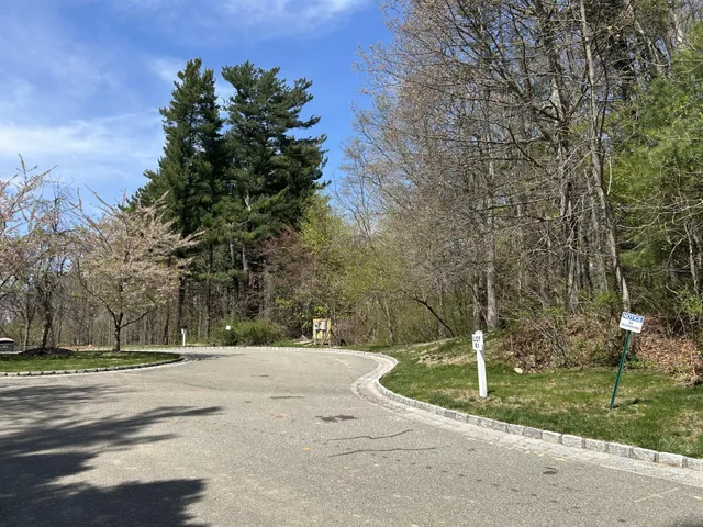 a living room with lots of furniture and a large window