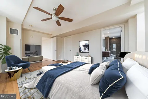 a bedroom with a bed and a couch