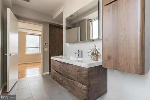 a bathroom with a sink and a mirror