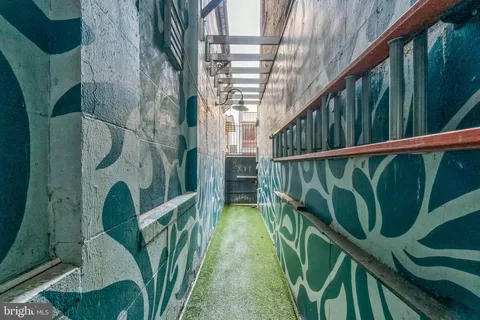 a view of balcony with wooden floor and plants