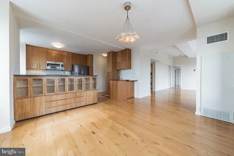 a view of a kitchen with a sink dishwasher and a large refrigerator