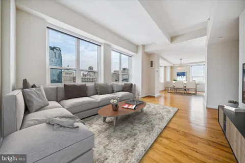 a living room with furniture and a rug