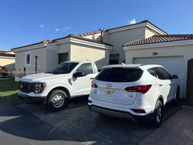 a car parked in front of a house