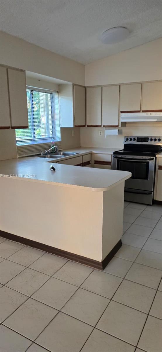 8906 Southwest 6th Lane Miami, FL 33174 - Photo 12 of 12 a kitchen with stainless steel appliances a stove a sink and a refrigerator