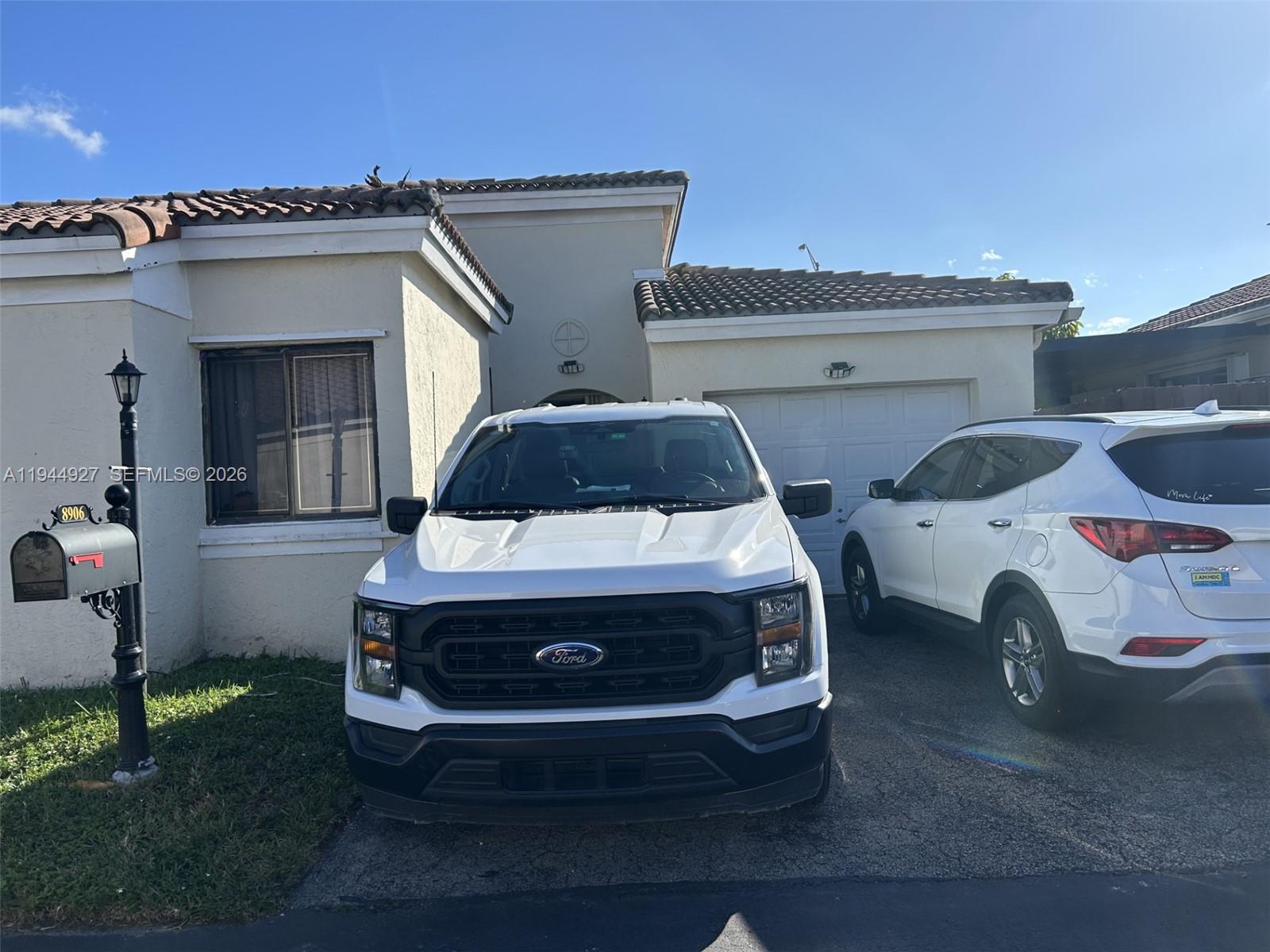 8906 Southwest 6th Lane Miami, FL 33174 - Photo 3 of 12 a car parked in front of a house