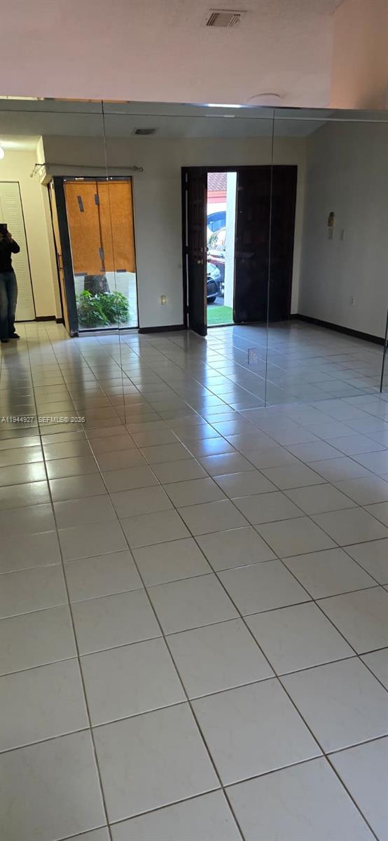 8906 Southwest 6th Lane Miami, FL 33174 - Photo 4 of 12 a view of empty room with window and fireplace