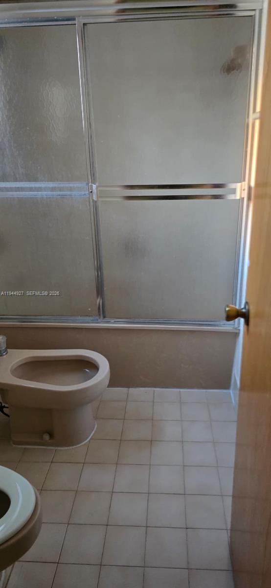 8906 Southwest 6th Lane Miami, FL 33174 - Photo 10 of 12 a bathroom with a toilet and a shower