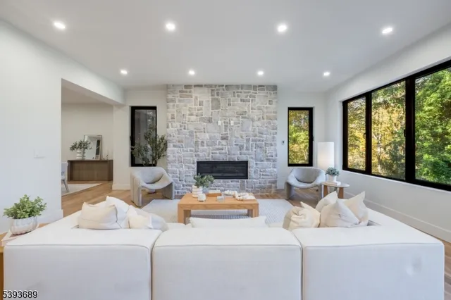 a living room with furniture and a fireplace