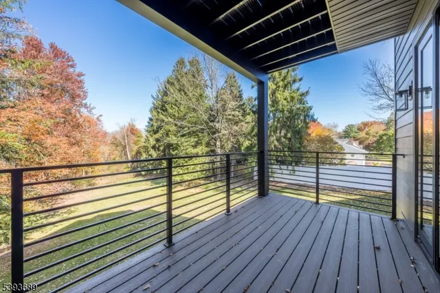 a view of a balcony with wooden floor