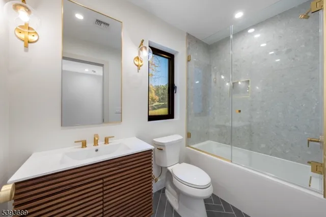 a bathroom with a sink a toilet and a bathtub