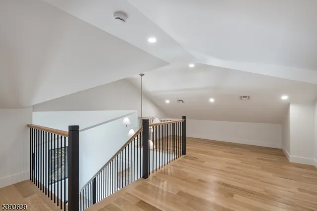 a view of a hallway with stairs