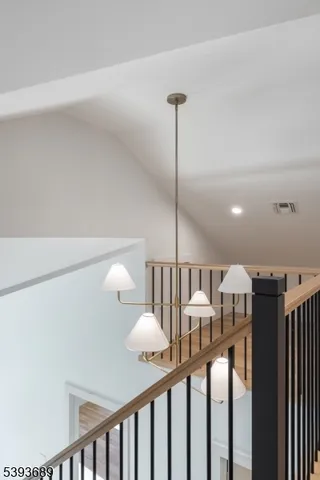 a view of a hallway with furniture