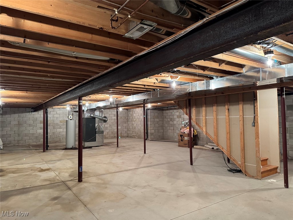3718 Babcock Road Williamsfield, OH 44093 - Photo 29 of 31 Basement featuring heating unit and gas water heater
