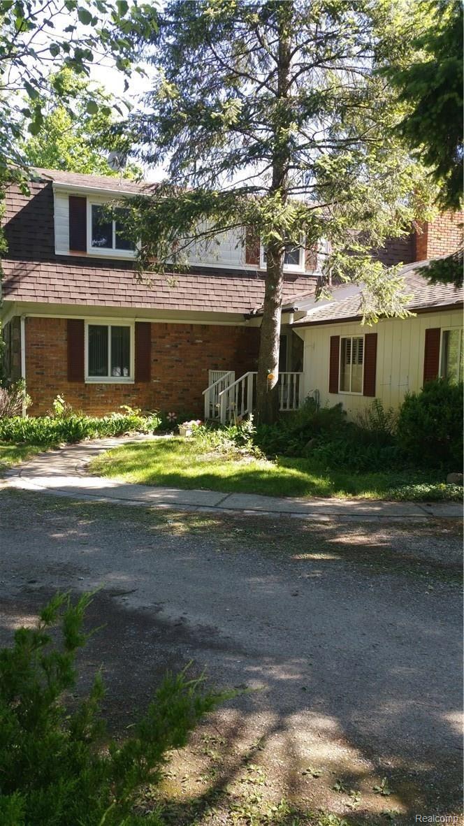 1870 Decker Road Walled Lake, MI 48390 - Photo 1 of 60 An inviting entrance, come on in!