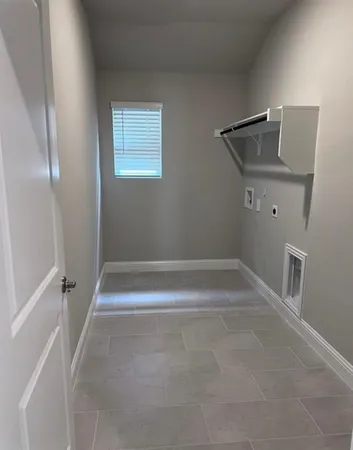 a view of room with window and hardwood floor