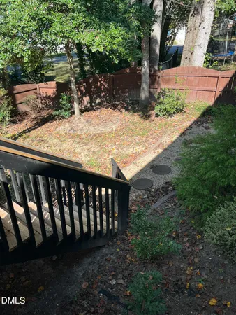 a view of wooden fence of a house
