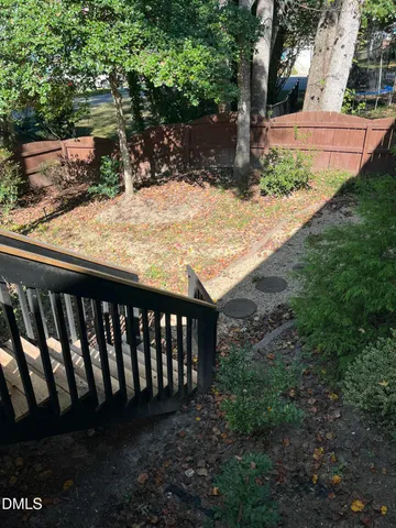 a view of wooden fence of a house