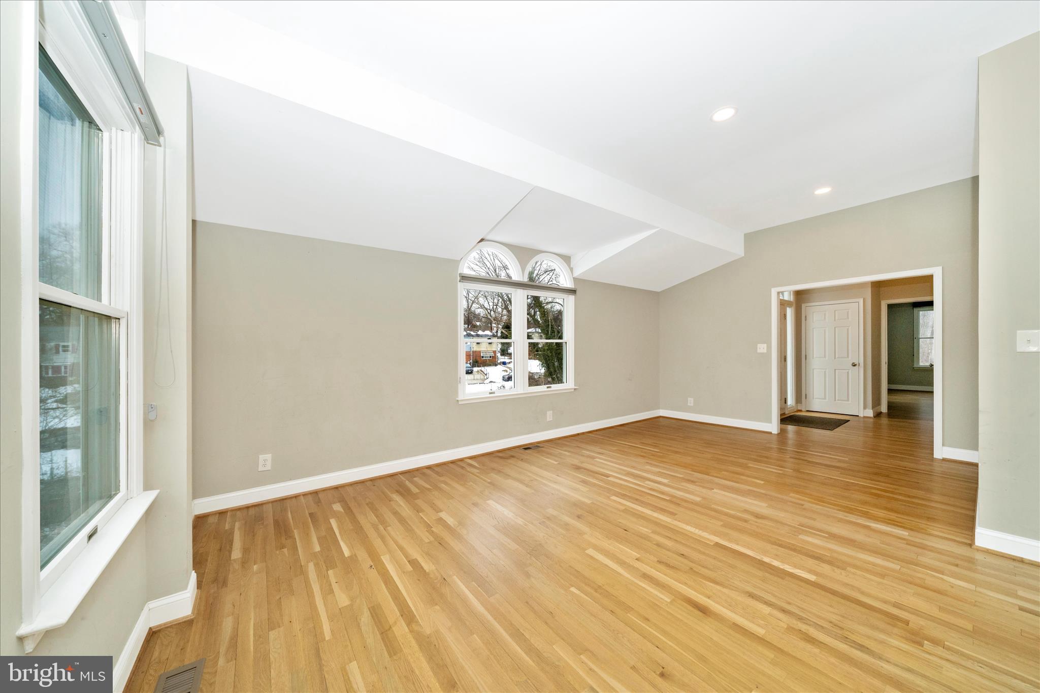 3313 Moline Road Silver Spring, MD 20902 - Photo 10 of 66 a view of an empty room with wooden floor and a window