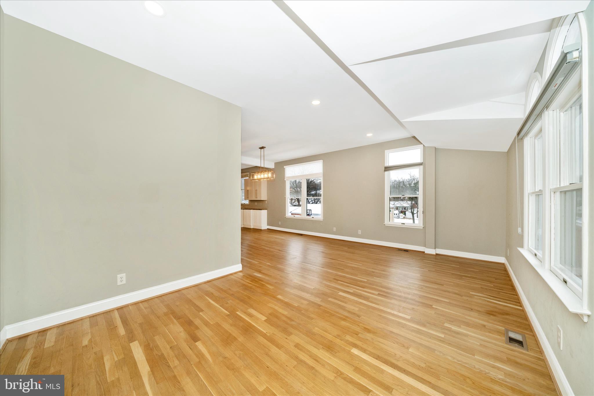 3313 Moline Road Silver Spring, MD 20902 - Photo 11 of 66 a view of an empty room with window and wooden floor