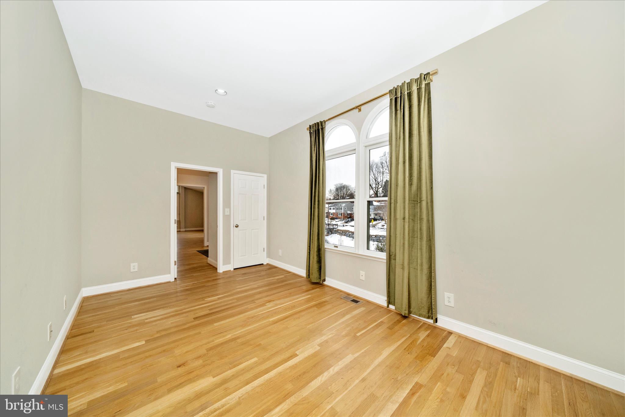 3313 Moline Road Silver Spring, MD 20902 - Photo 16 of 66 a view of an empty room with wooden floor and a window