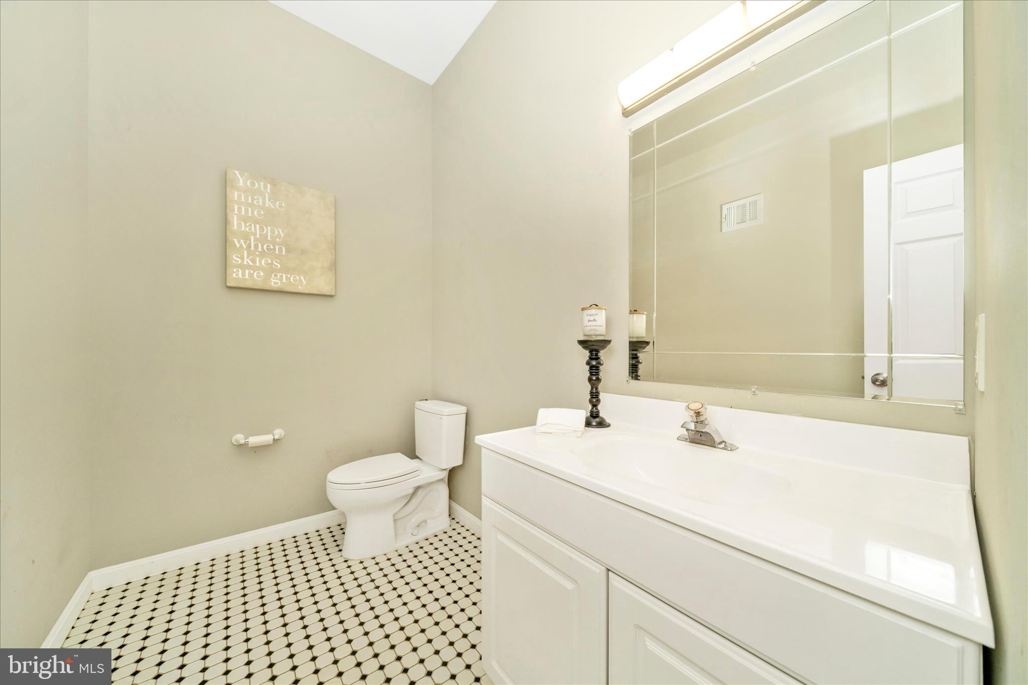 3313 Moline Road Silver Spring, MD 20902 - Photo 24 of 66 a bathroom with a sink a toilet and a mirror