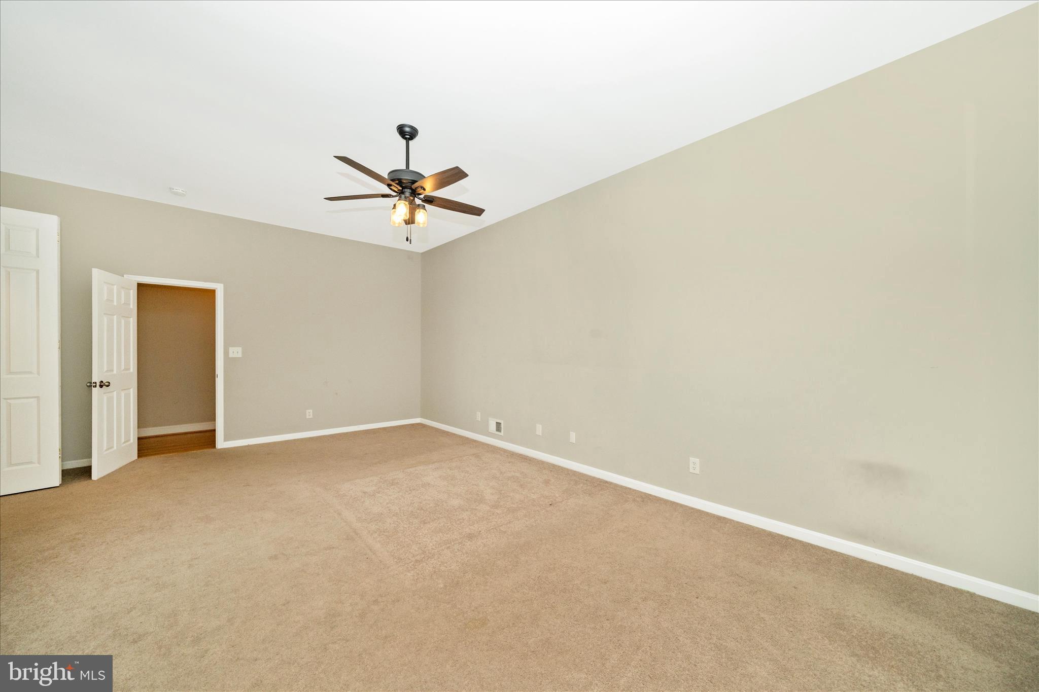 3313 Moline Road Silver Spring, MD 20902 - Photo 29 of 66 an empty room with a ceiling fan and a window