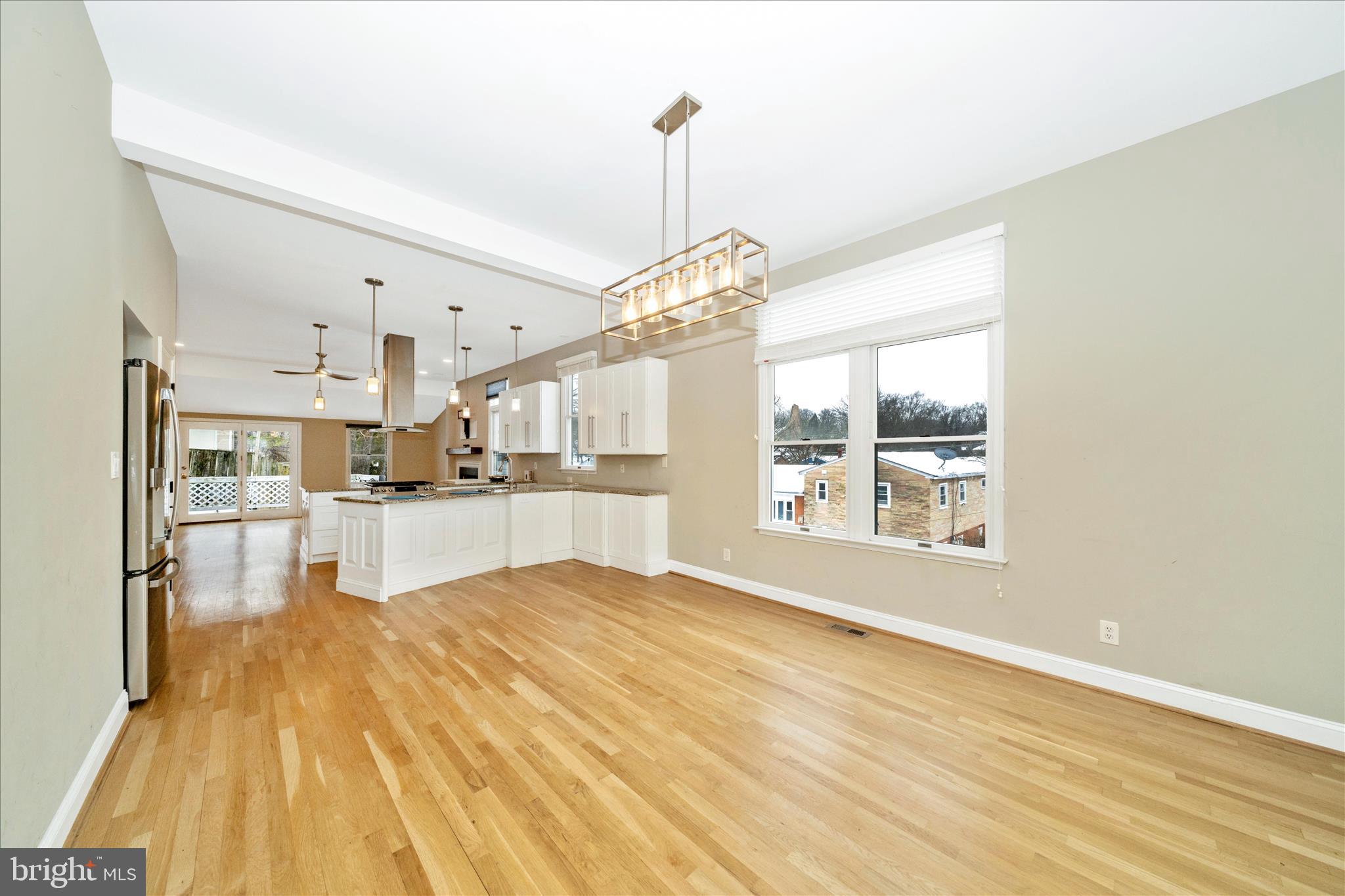 3313 Moline Road Silver Spring, MD 20902 - Photo 65 of 66 a view of a kitchen with kitchen island a counter top space a sink stainless steel appliances and cabinets